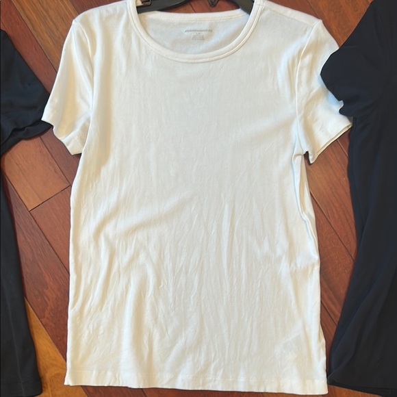 Women large Amazon tops in white and black. One top has a wider neckline. - Picture 3 of 14